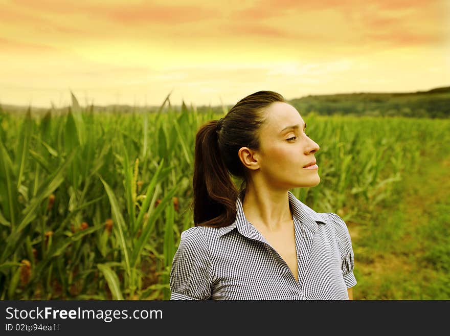 Beautiful woman standing on wheat field. Beautiful woman standing on wheat field