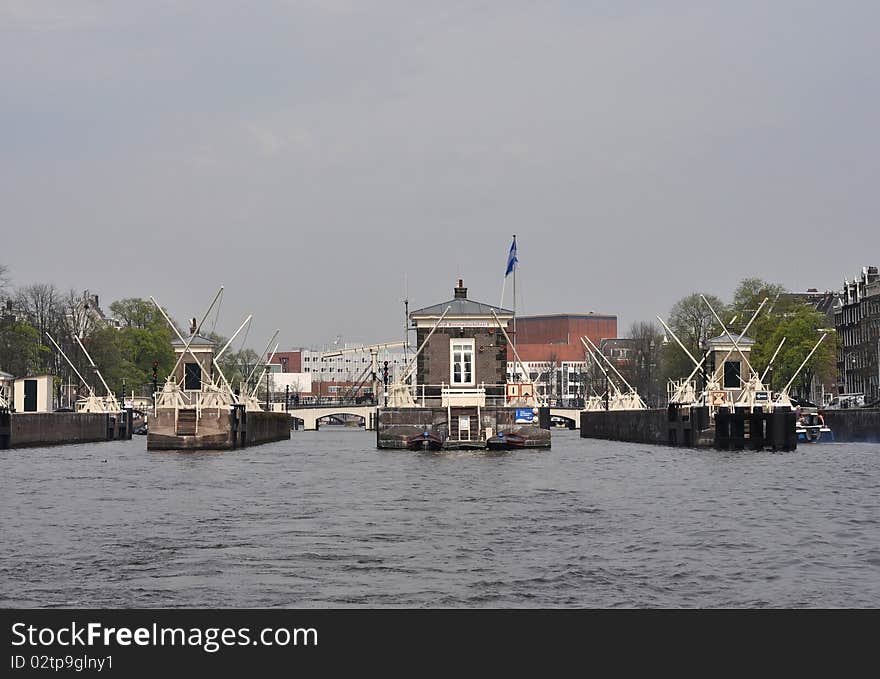 Nice Amsterdam sluice (lock), channels, bridges and boats. Very good place for trevelling and rest. Nice Amsterdam sluice (lock), channels, bridges and boats. Very good place for trevelling and rest