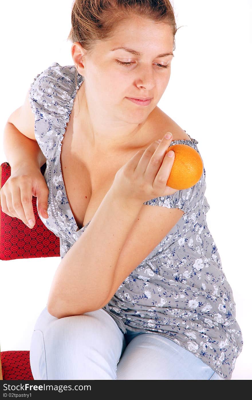 Young girl holding orange fruit isolated on white background. Young girl holding orange fruit isolated on white background