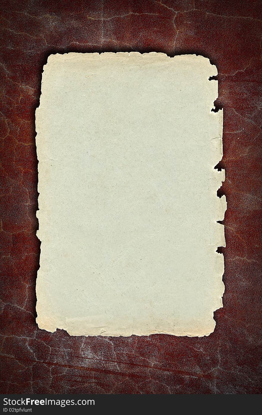 Vintage aged with worn edges light brown paper texture for background designs. Vintage aged with worn edges light brown paper texture for background designs