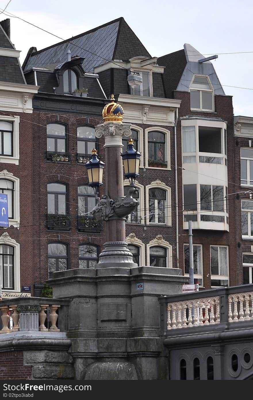 These are very nice historical Amsterdam bridge.  Handsome and interesting architecture all around. View from the boat. Tourism, Europe, Amsterdam, buildings, boats, bridges. These are very nice historical Amsterdam bridge.  Handsome and interesting architecture all around. View from the boat. Tourism, Europe, Amsterdam, buildings, boats, bridges