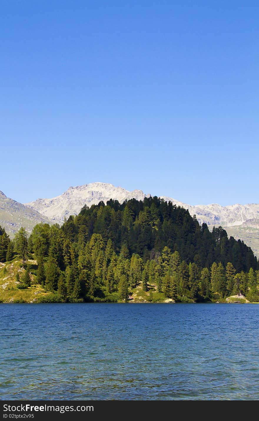 Alpine lake Cavloc Engadine in Switzerland