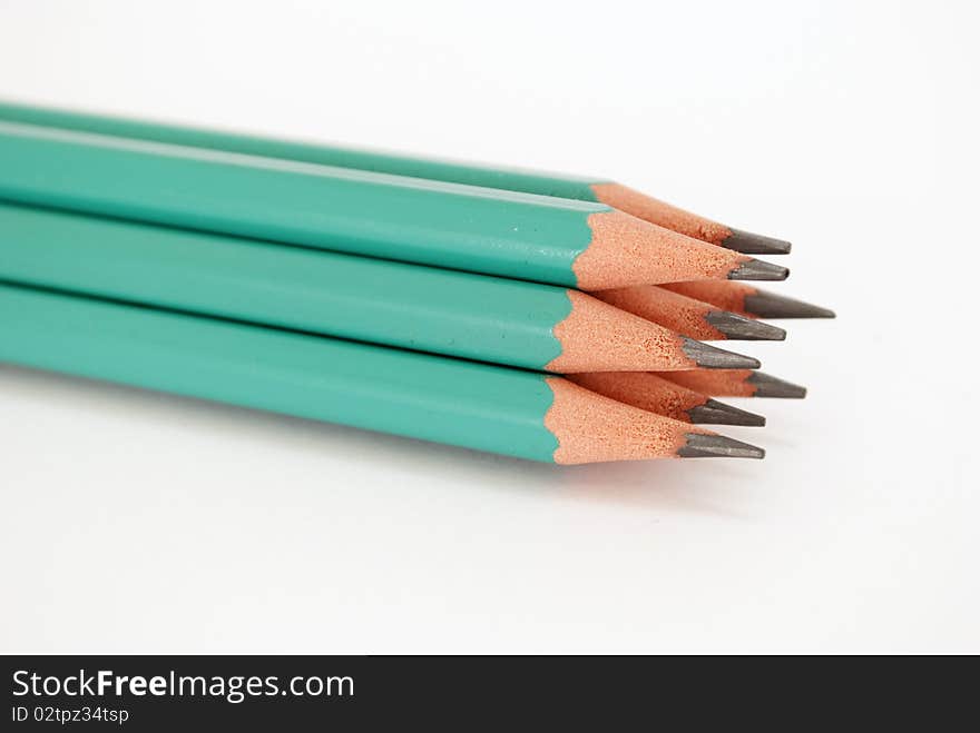 Green pencils tipped with white background isolated