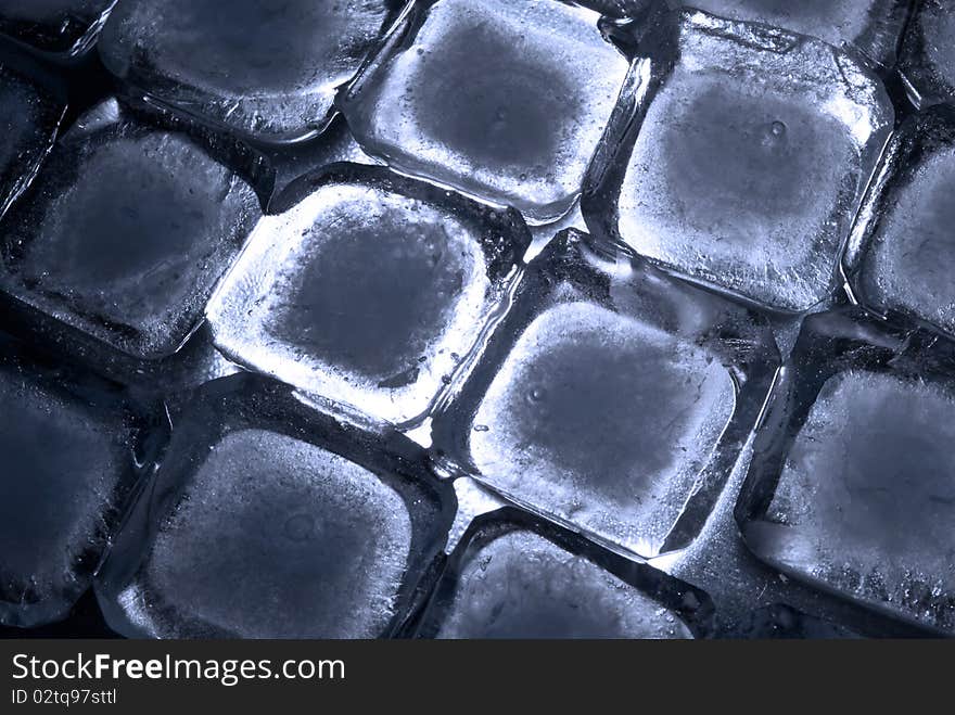 Ice cubes, ordered in rows, in back-light