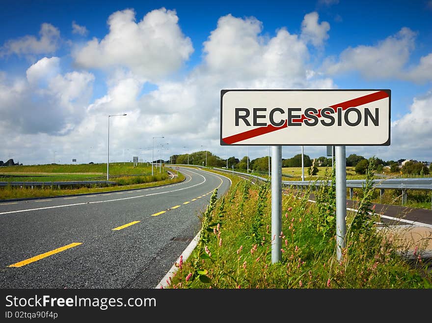 Road with recession sign crossed with red line