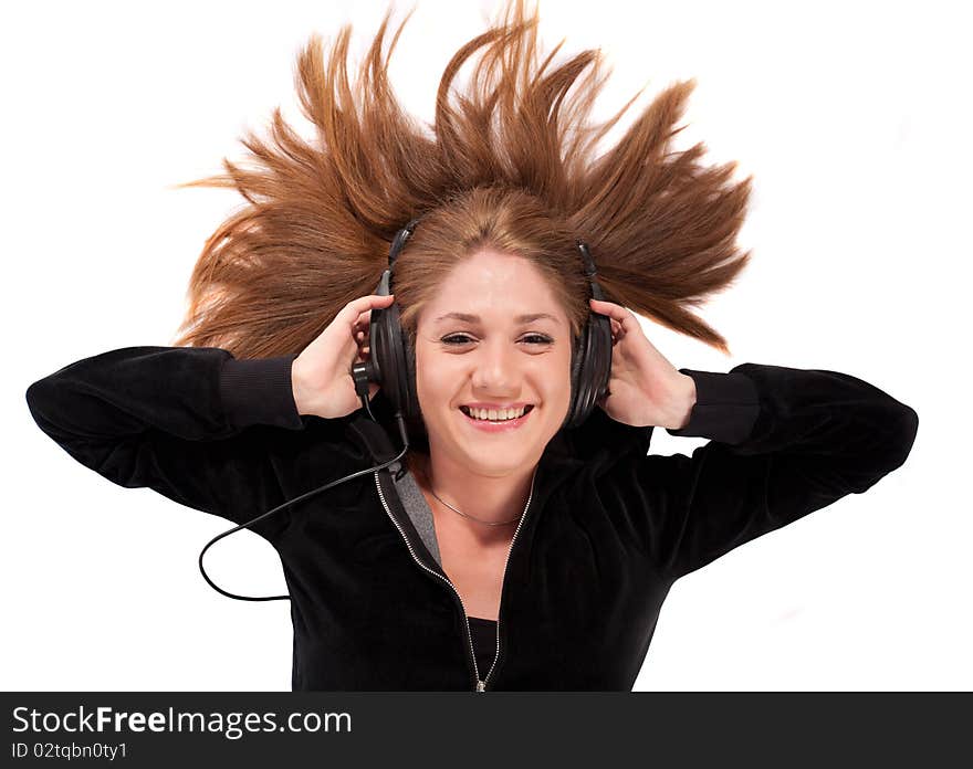 Young woman laid on her back enjoying music