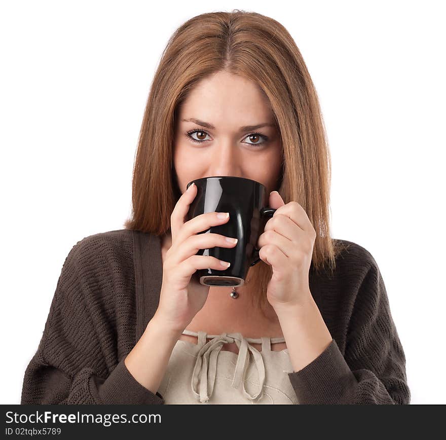 Young woman sipping from a cup