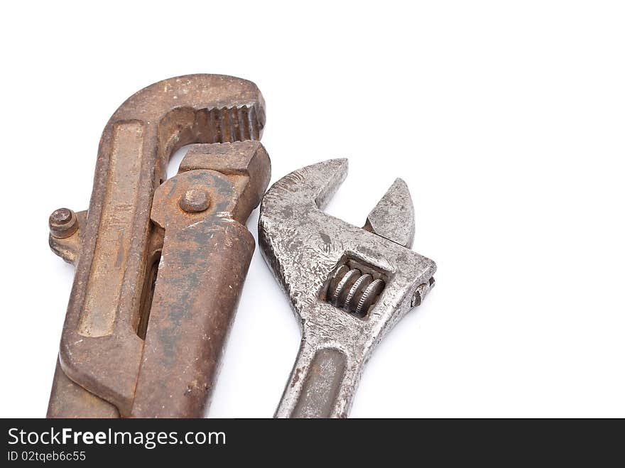 Rusty metal screw-wrenches on white