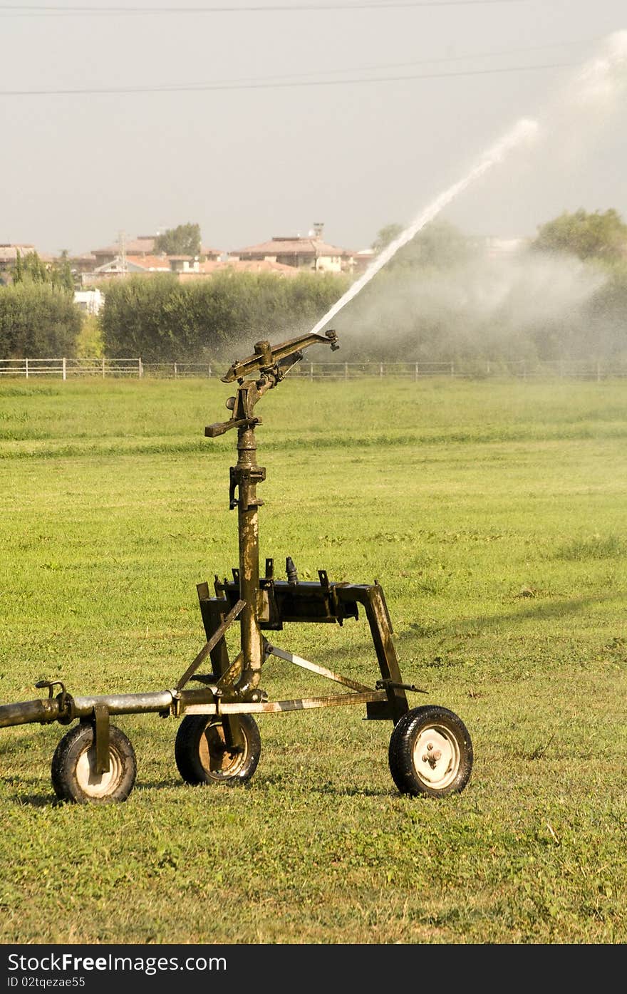 High range sprinkler in a field. High range sprinkler in a field