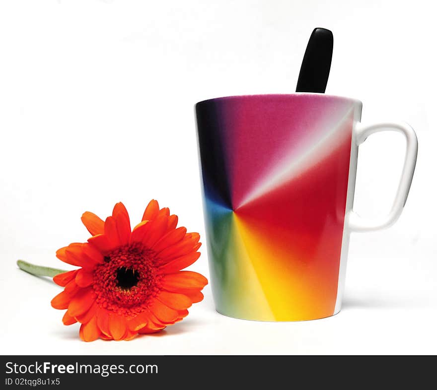 Cup of coffee and red flower on white background. Cup of coffee and red flower on white background