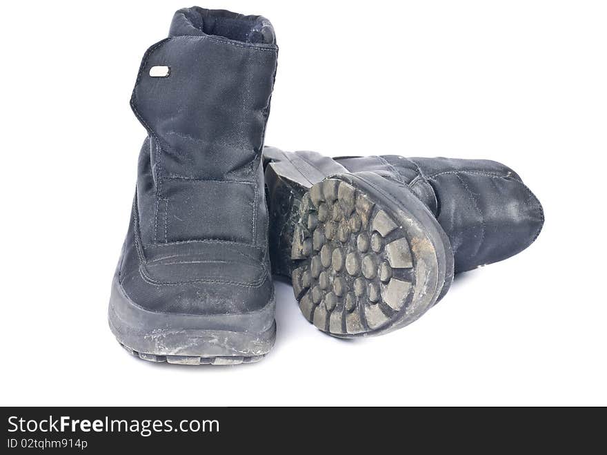 A pair of woman's black nylon winter boots isolated on white.