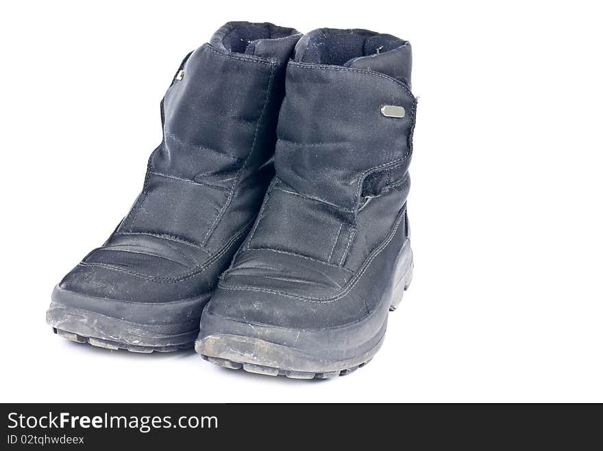 A pair of woman's black nylon winter boots isolated on white.