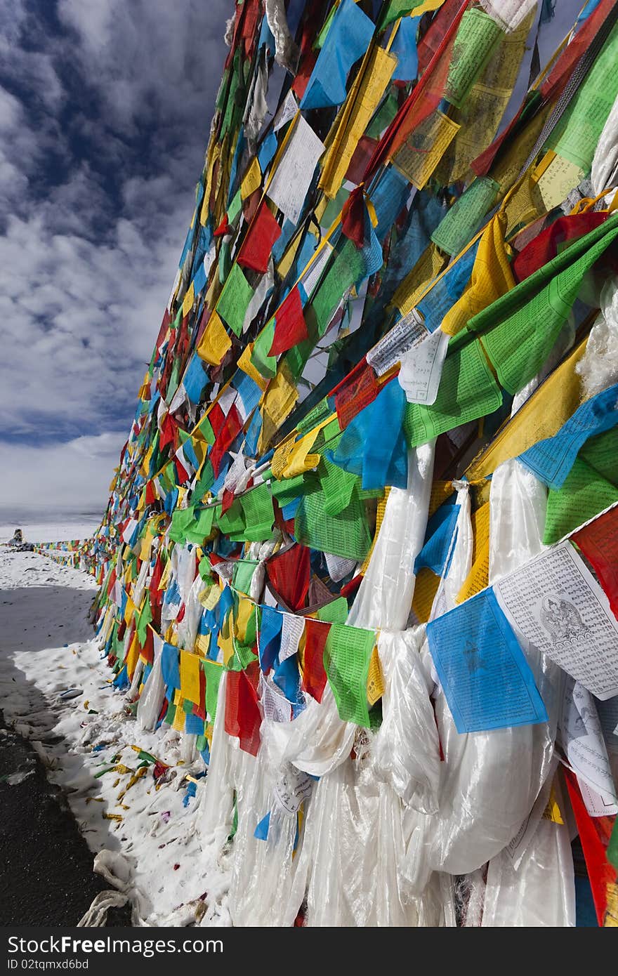 Strings of tibetan prayer flags in the snow. Strings of tibetan prayer flags in the snow.