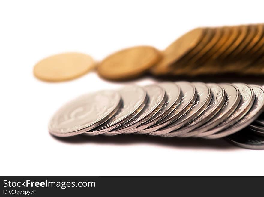 Scattered coins on a white background. Scattered coins on a white background