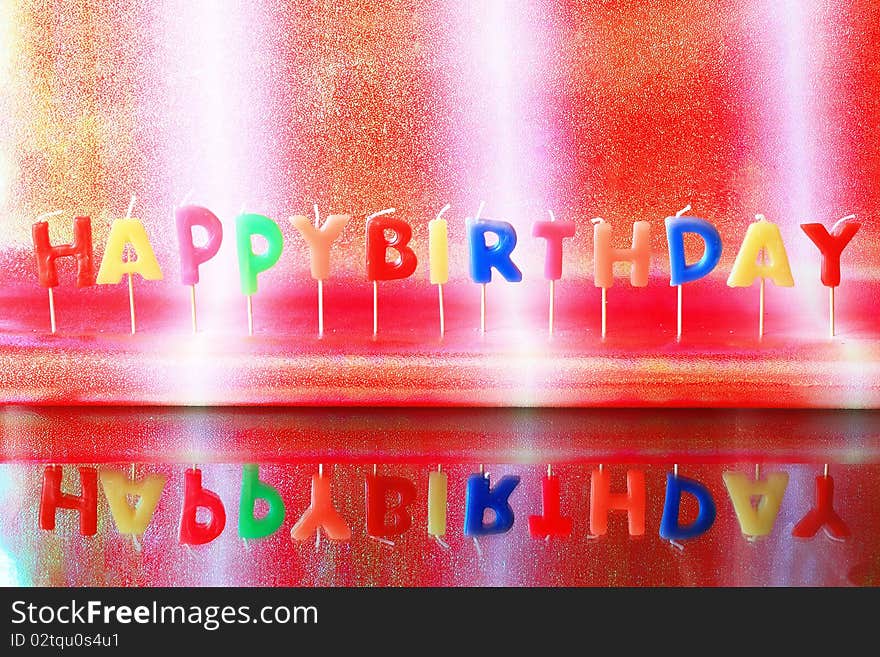 Birthday candles on colorful background