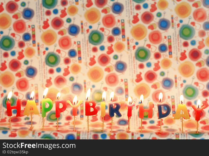 Birthday candles on colorful background