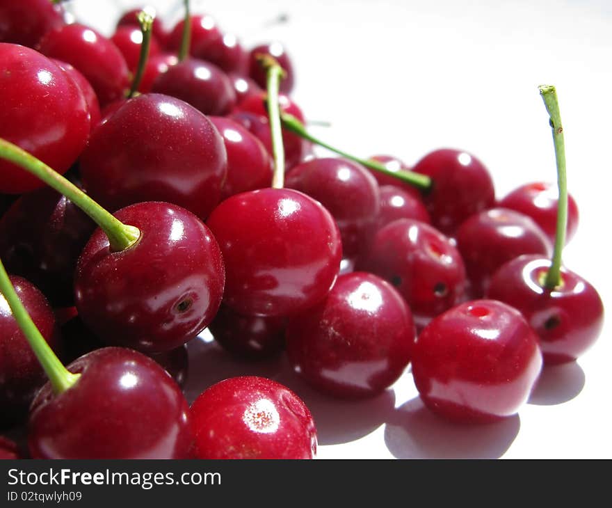 Wonderful red cherries on white background