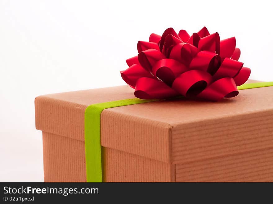 Red Bow On Present Box With Green Ribbon