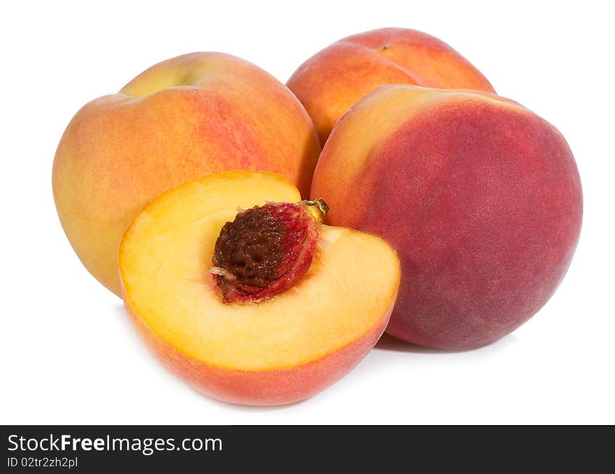 Fresh peaches on white background