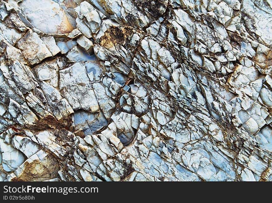 A sample of natural mountain rock texture. A sample of natural mountain rock texture