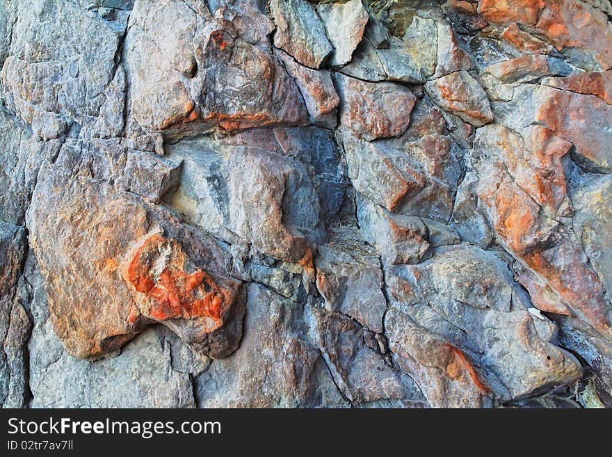 A sample of natural mountain rock texture. A sample of natural mountain rock texture