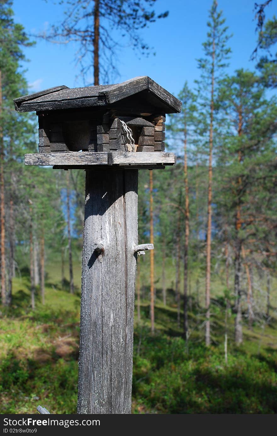 Wooden rack for wild birds in Finnish forest