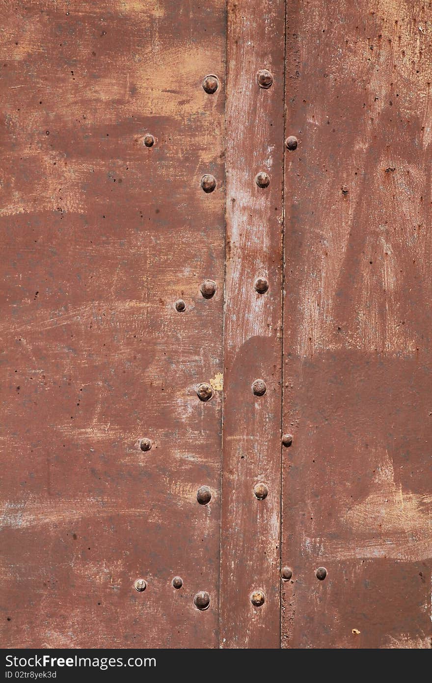 A rusty metal brown old door. A rusty metal brown old door