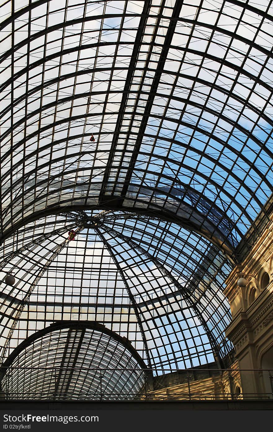 Glass modern ceiling in a shopping centre. Glass modern ceiling in a shopping centre.