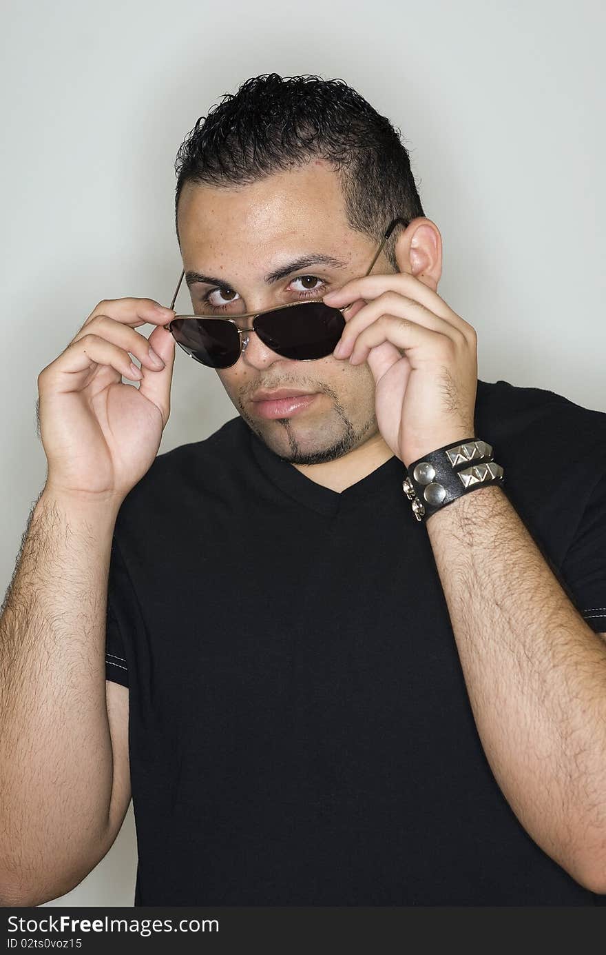 Young hispanic man on a black background. Young hispanic man on a black background