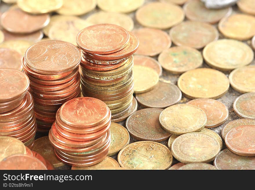 Lots of coins dropped on flat surface - flat view, texture of coins. Lots of coins dropped on flat surface - flat view, texture of coins