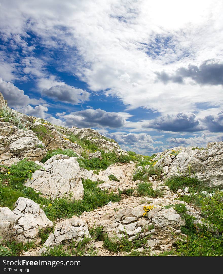 Blue sky with clouds above mountain