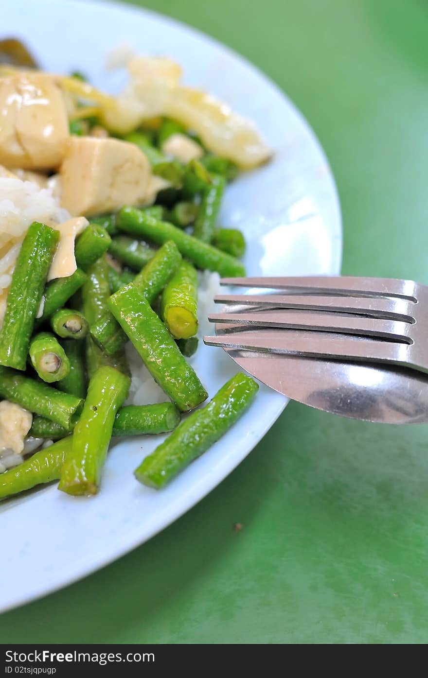 Chinese style long beans cuisine served with rice. Suitable for food and beverage, healthy lifestyle, and diet and nutrition.