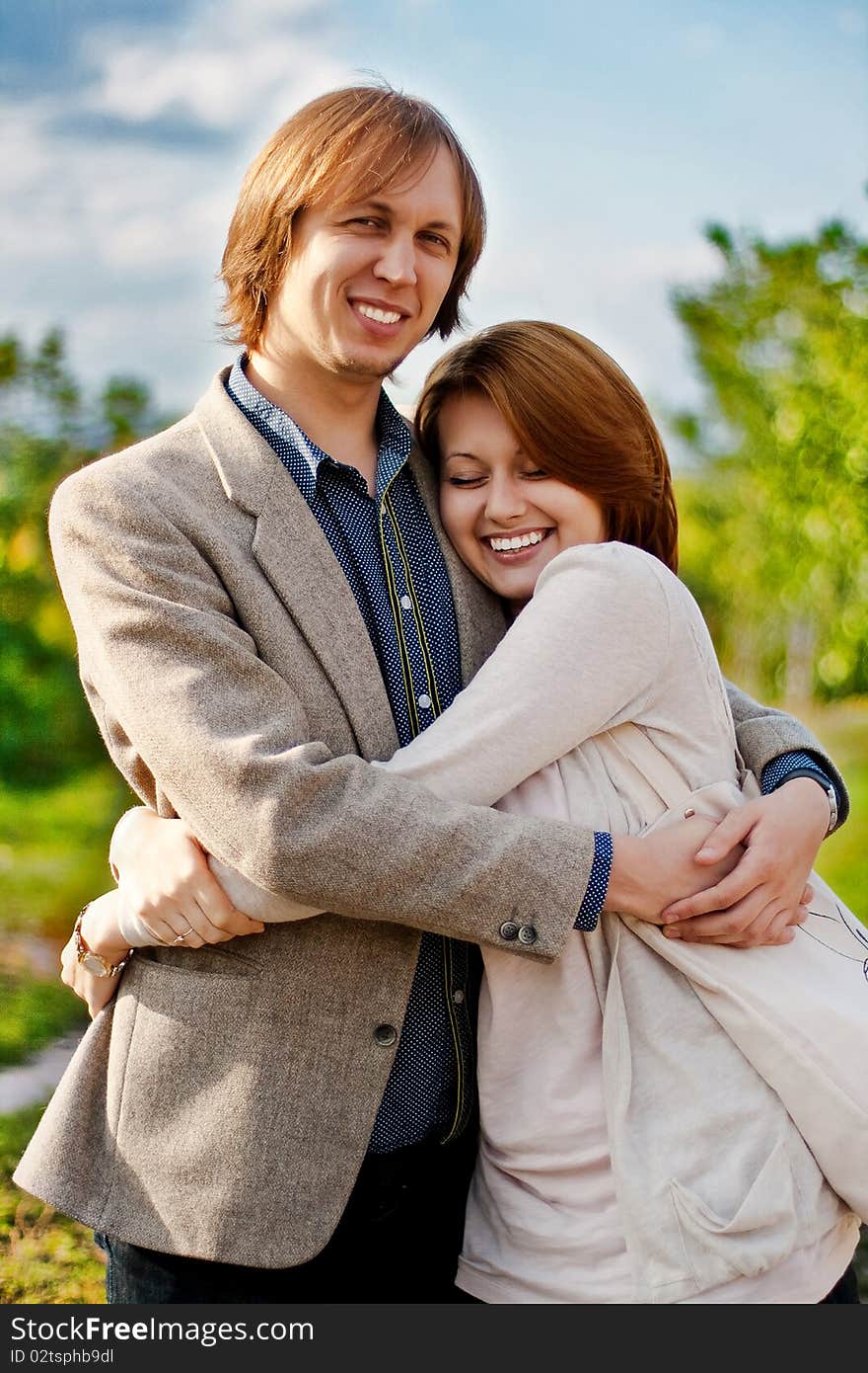 Love couple in embrace on the street