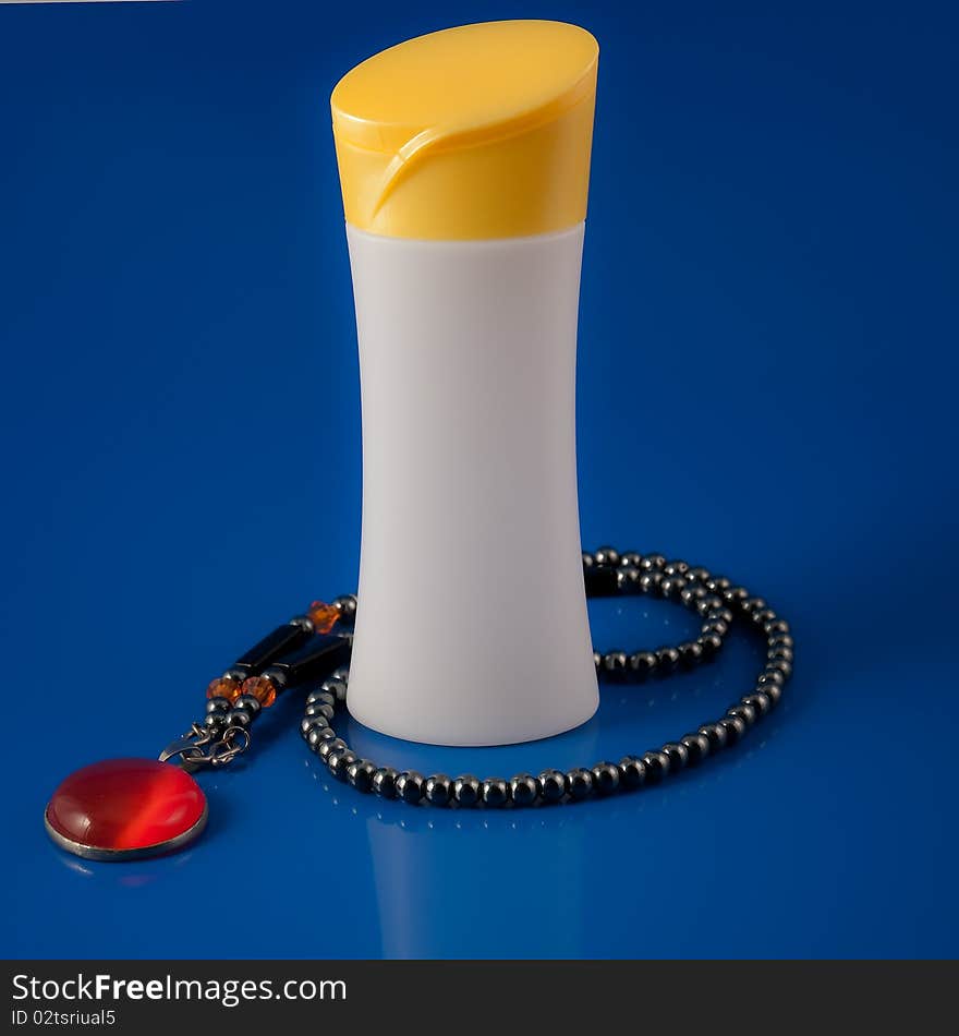 Cosmetic bottles on Blue background