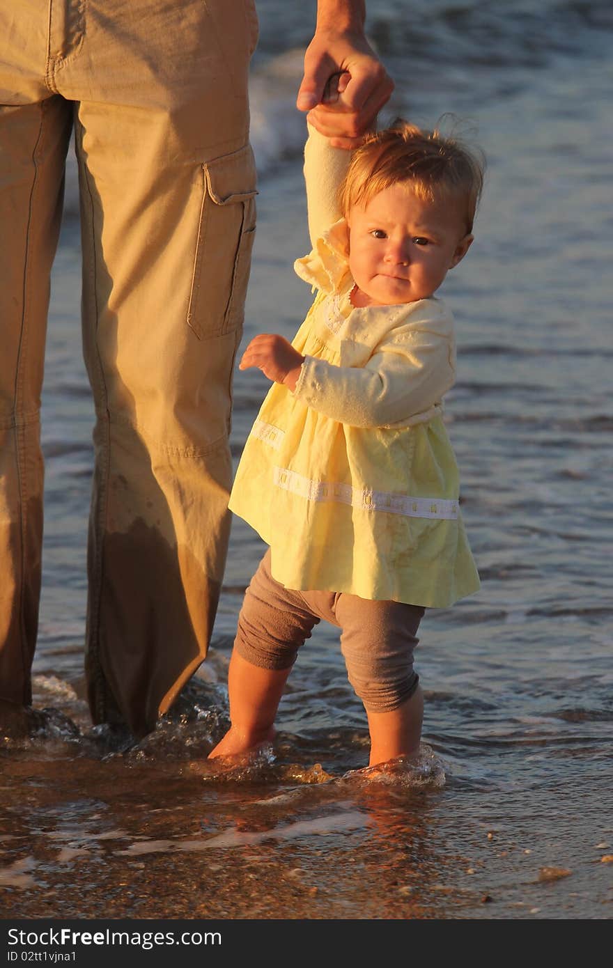 Child walks by the sea