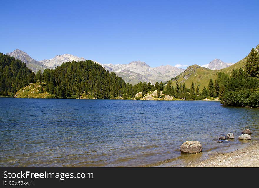 Alpine lake Cavloc Engadine in Switzerland