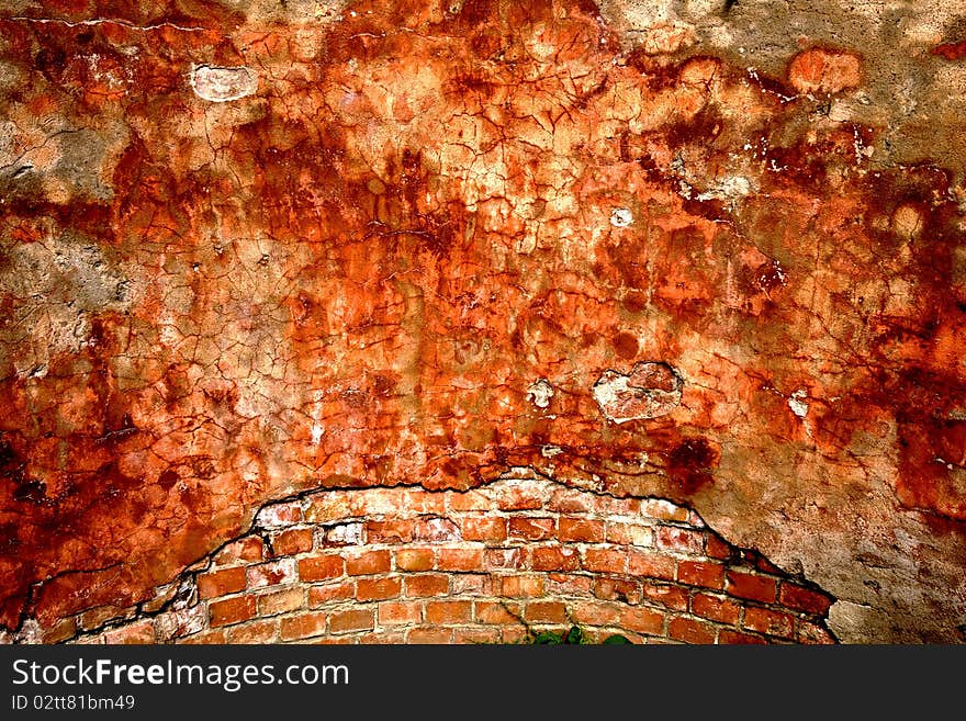 Textured wall with brick and stucco