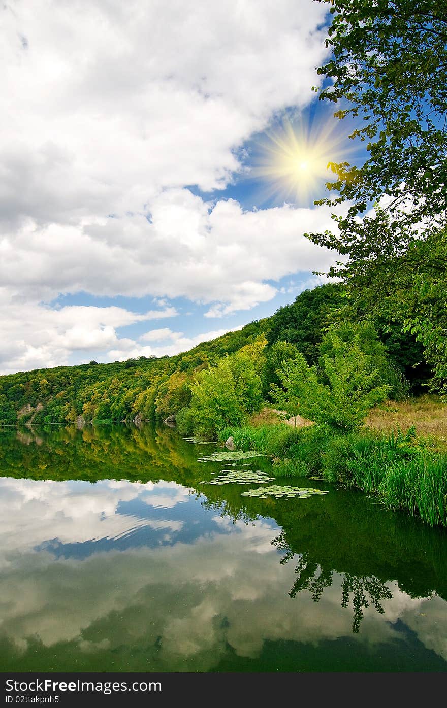 Wonderful sun above autumnal lake and forest. Wonderful sun above autumnal lake and forest.