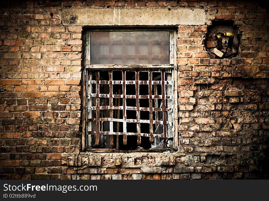 Old building window with rusty grate. Old building window with rusty grate