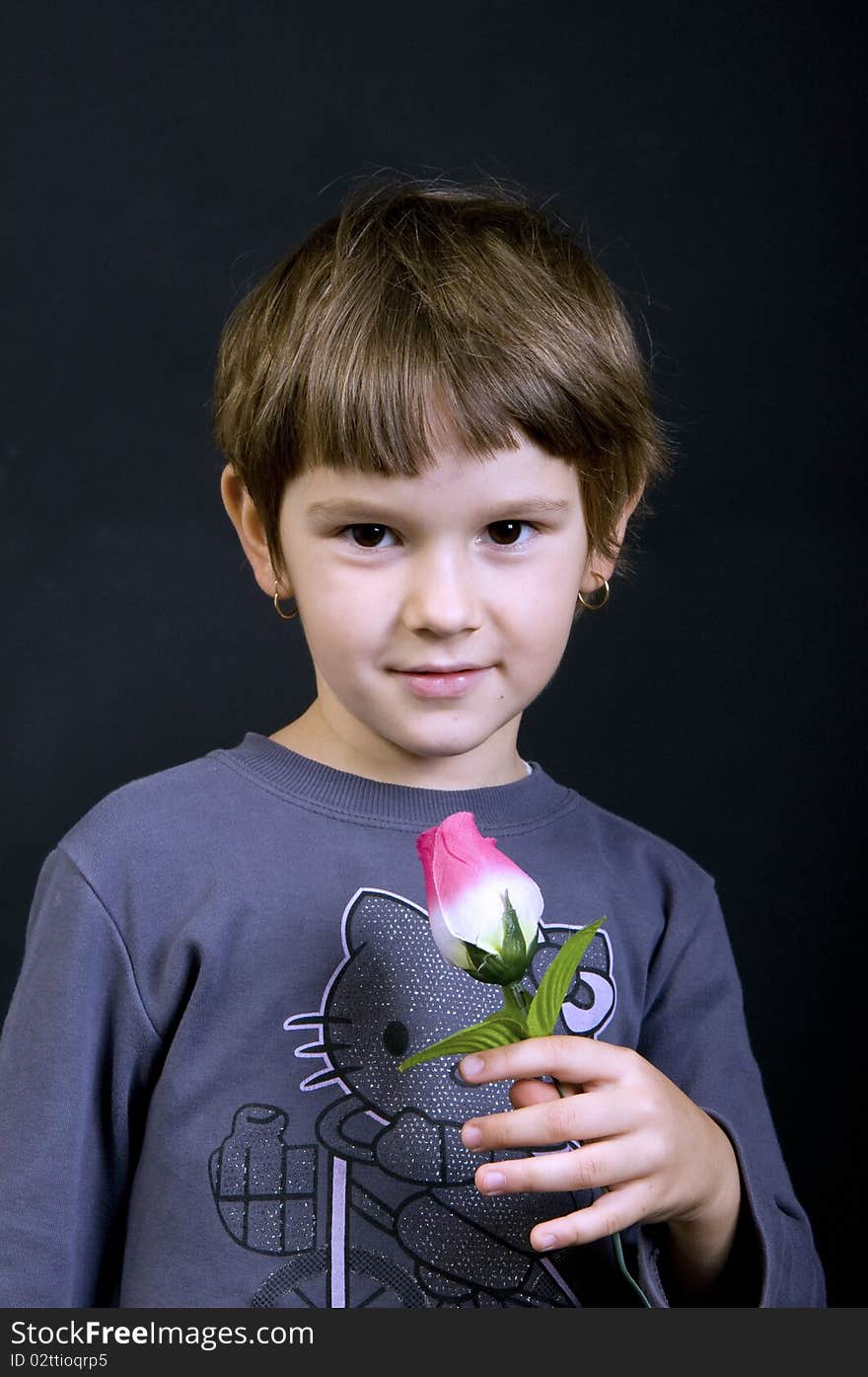 Cute girl is holding flowers. Cute girl is holding flowers