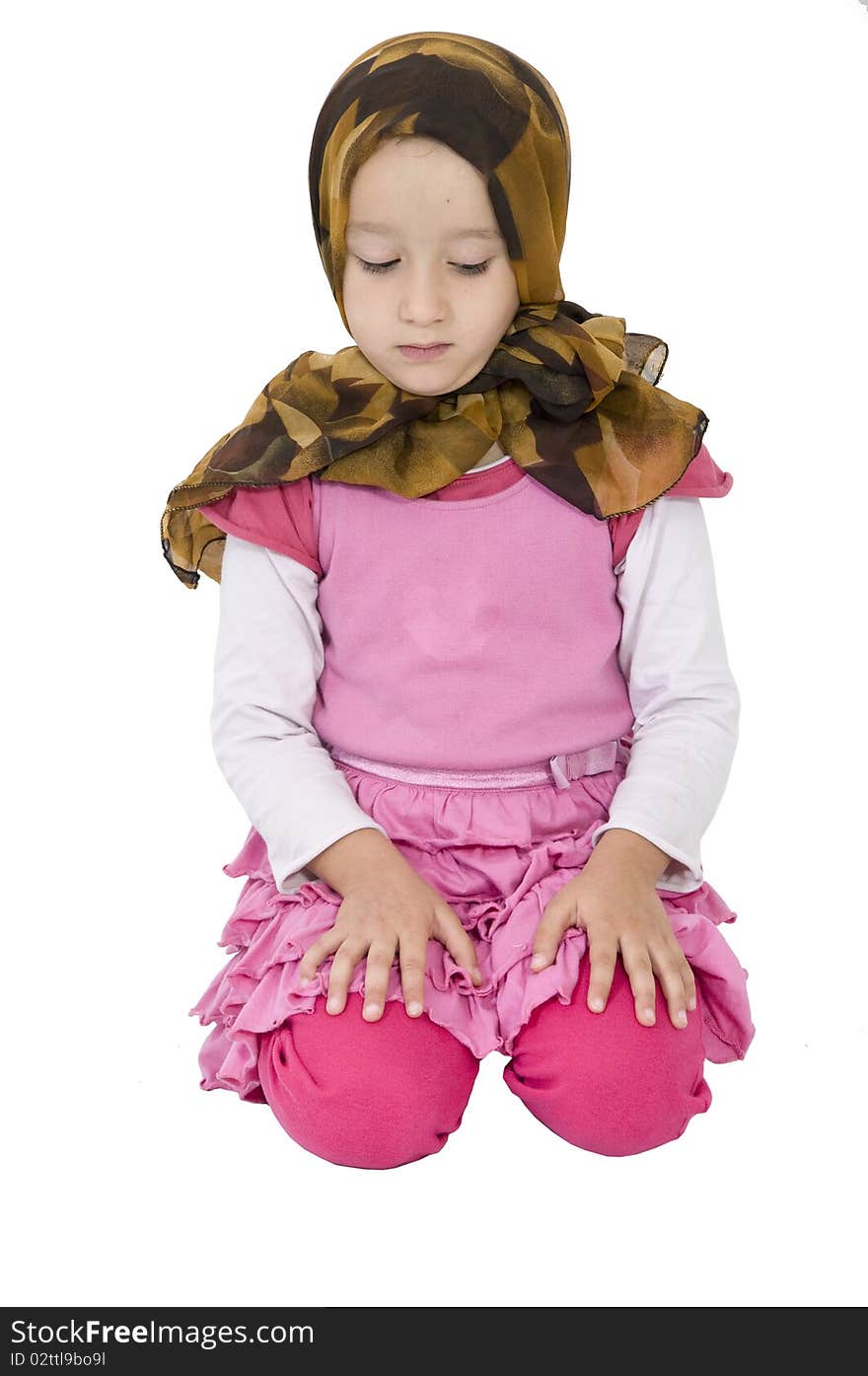 Cute little muslim girl is praying