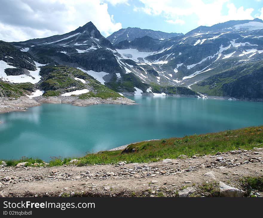 Beautifully situated alpine lake in the Alps Weissee. Beautifully situated alpine lake in the Alps Weissee