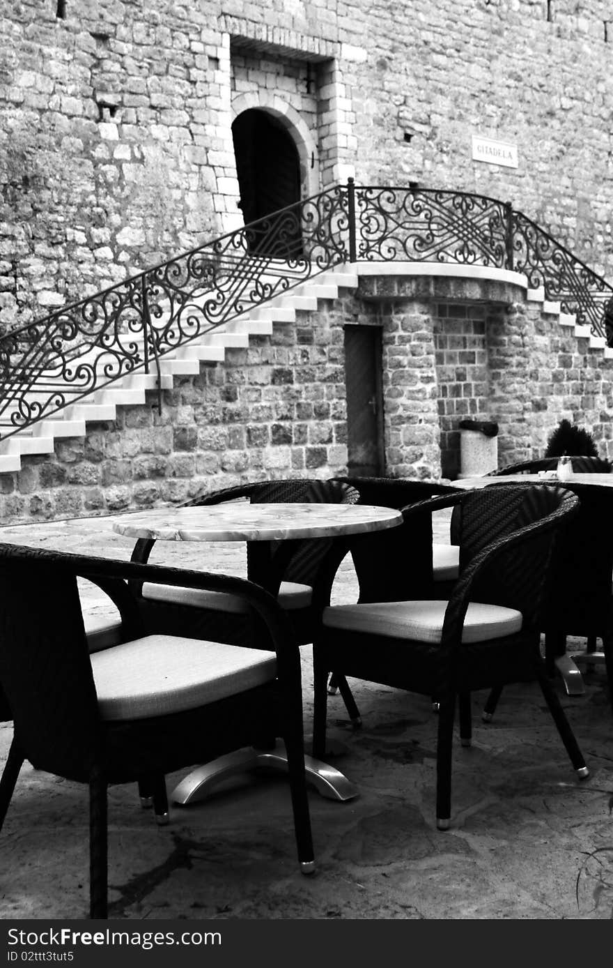 Cafe under walls of old citadel in Budva, Montenegro. Cafe under walls of old citadel in Budva, Montenegro.