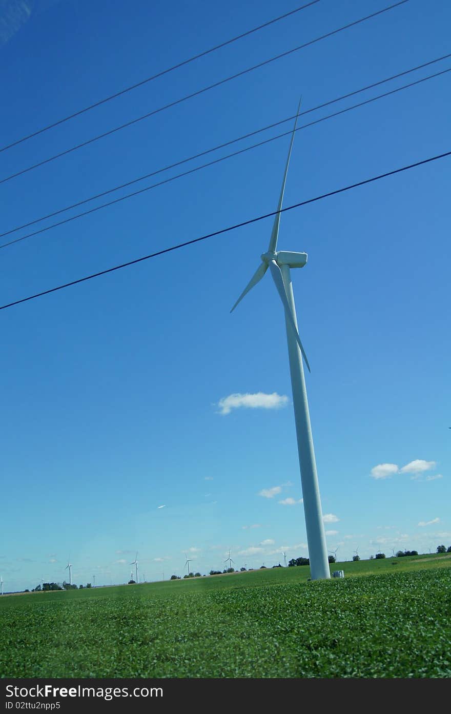 A windmill in indiana with blue sky.