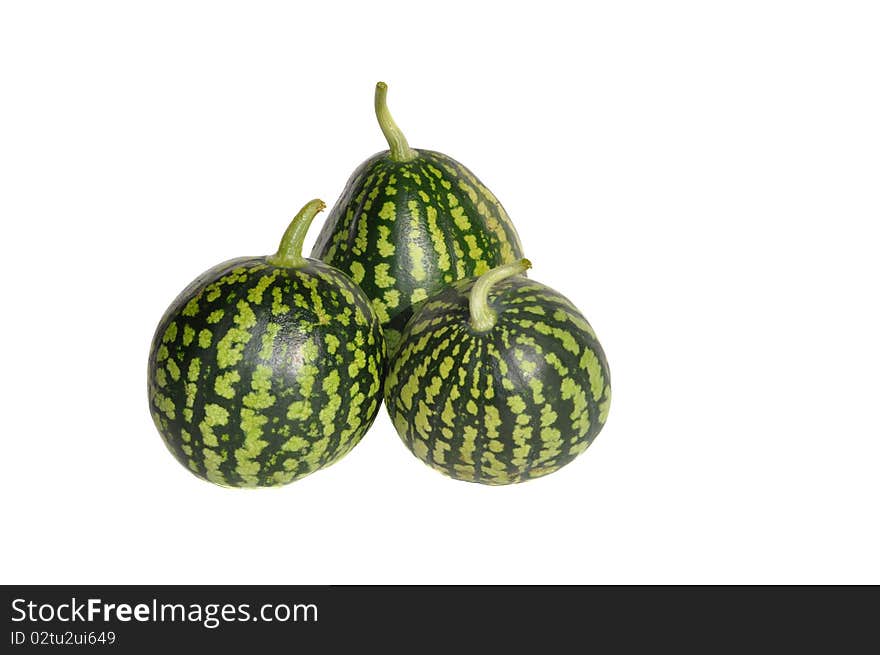 Three green small watermelons on white