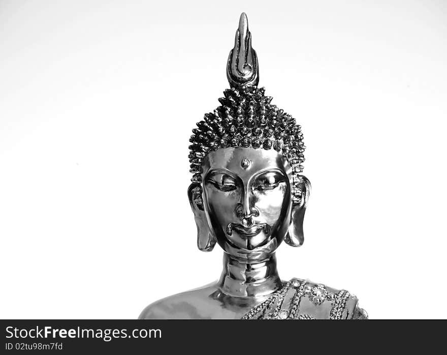 Close up of a metalic Budha on a white back. Close up of a metalic Budha on a white back