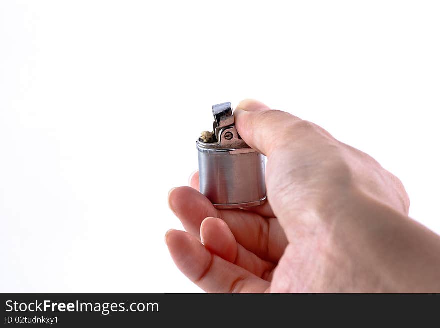 Lighter in a women hand taking lit action. Lighter in a women hand taking lit action