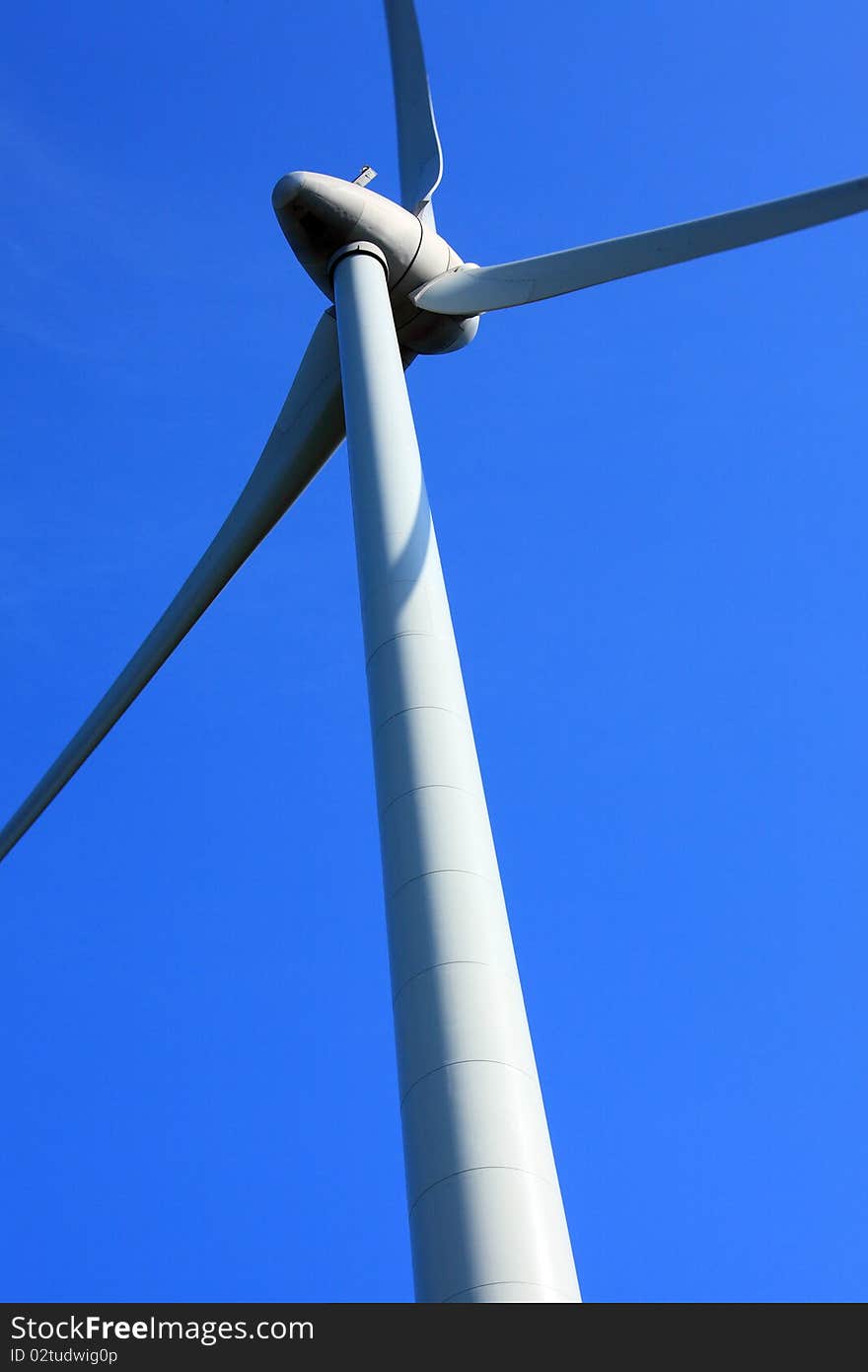 Wind turbine with blue sky in the background