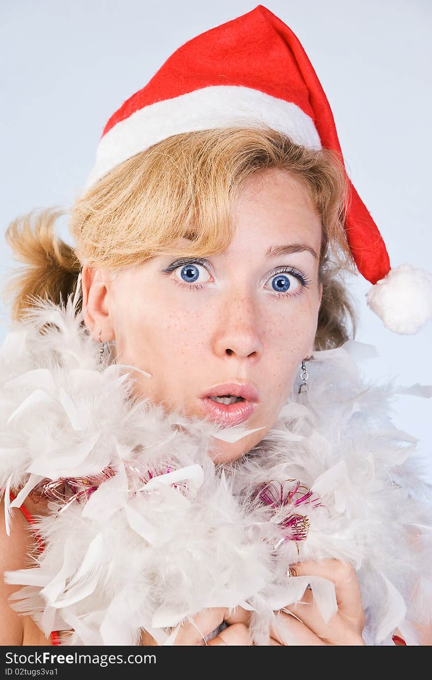 Portrait of surprised woman wearing santa claus clothes on white background. Portrait of surprised woman wearing santa claus clothes on white background