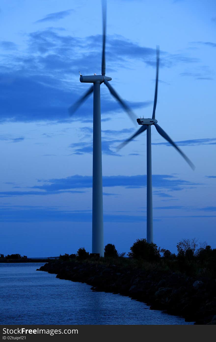 Two wind turbines in the evening light